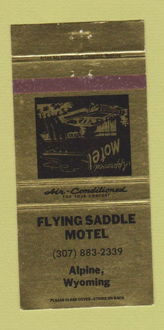 Matchbook Cover - Flying Saddle Motel Alpine WY GOLD 30 Strike