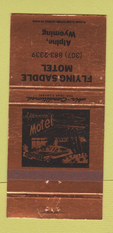 Matchbook Cover - Flying Saddle Motel Alpine WY BRONZE WEAR 30 Strike